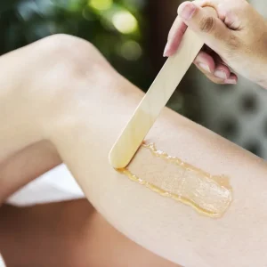 An Esthetician treats a person