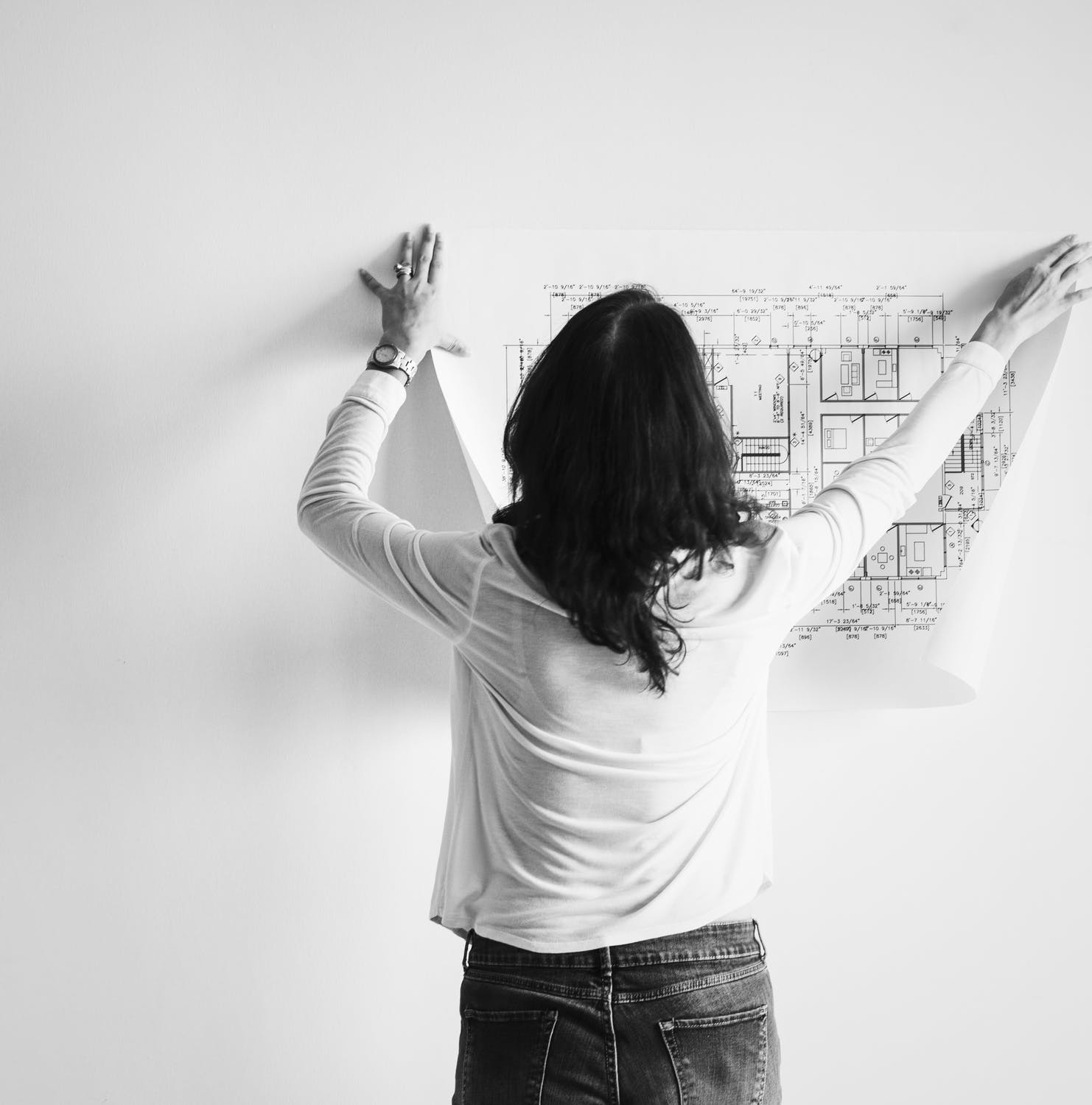 An architect shows a business plan a large document