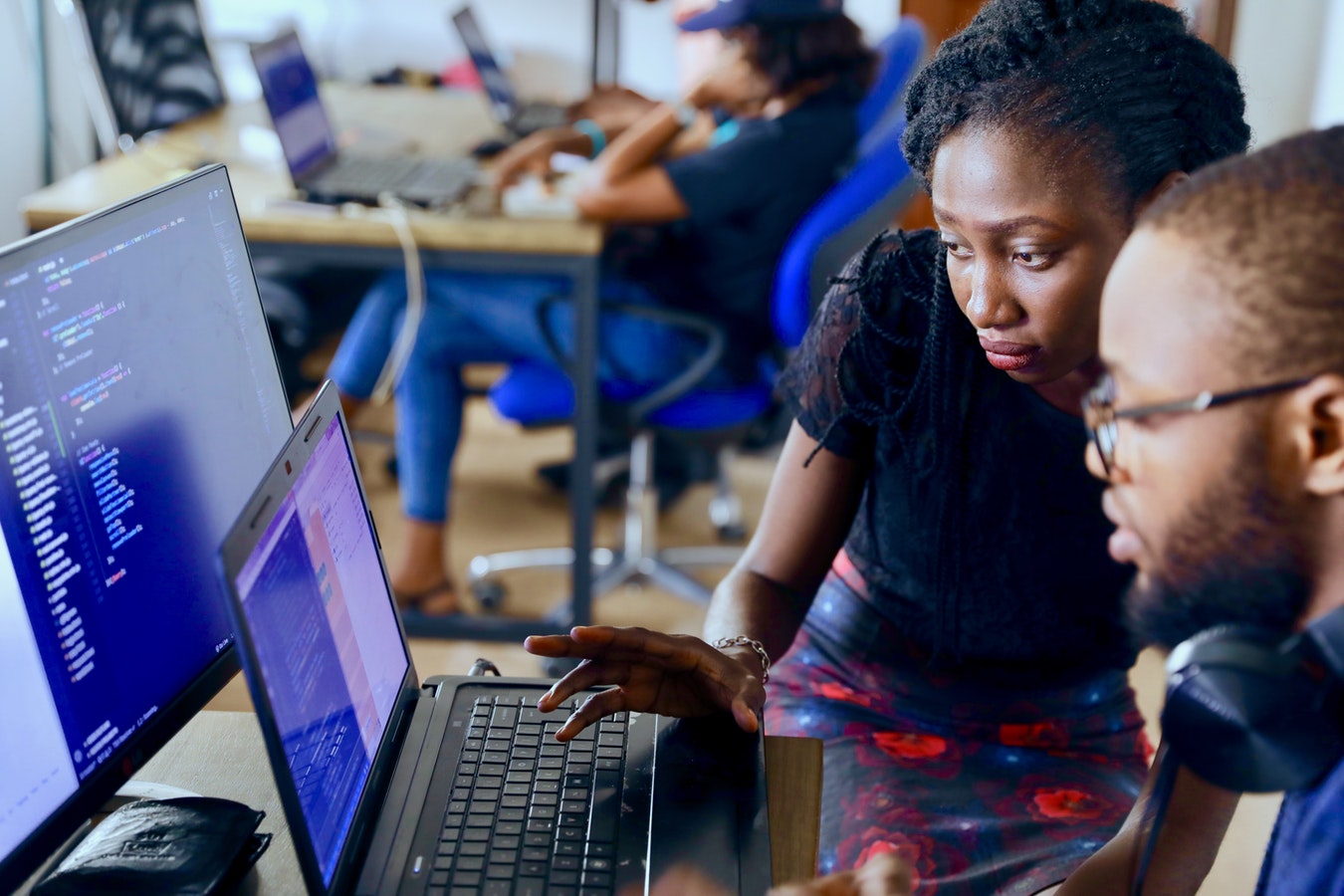 Two architects looking at architect system on a computer screen