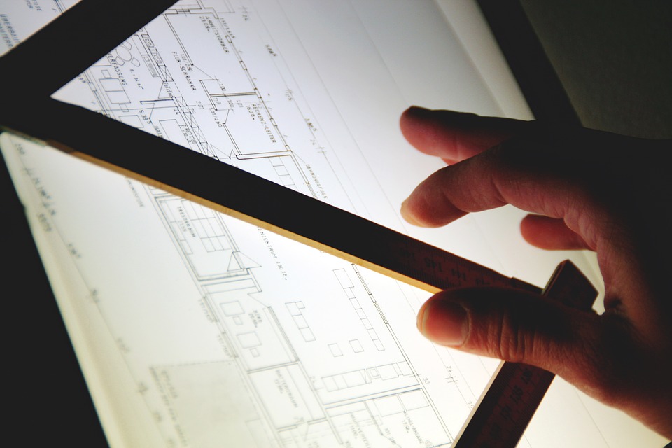 An architect with business planning and strategy in a paper