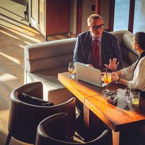 Two business consultants discussing in a office