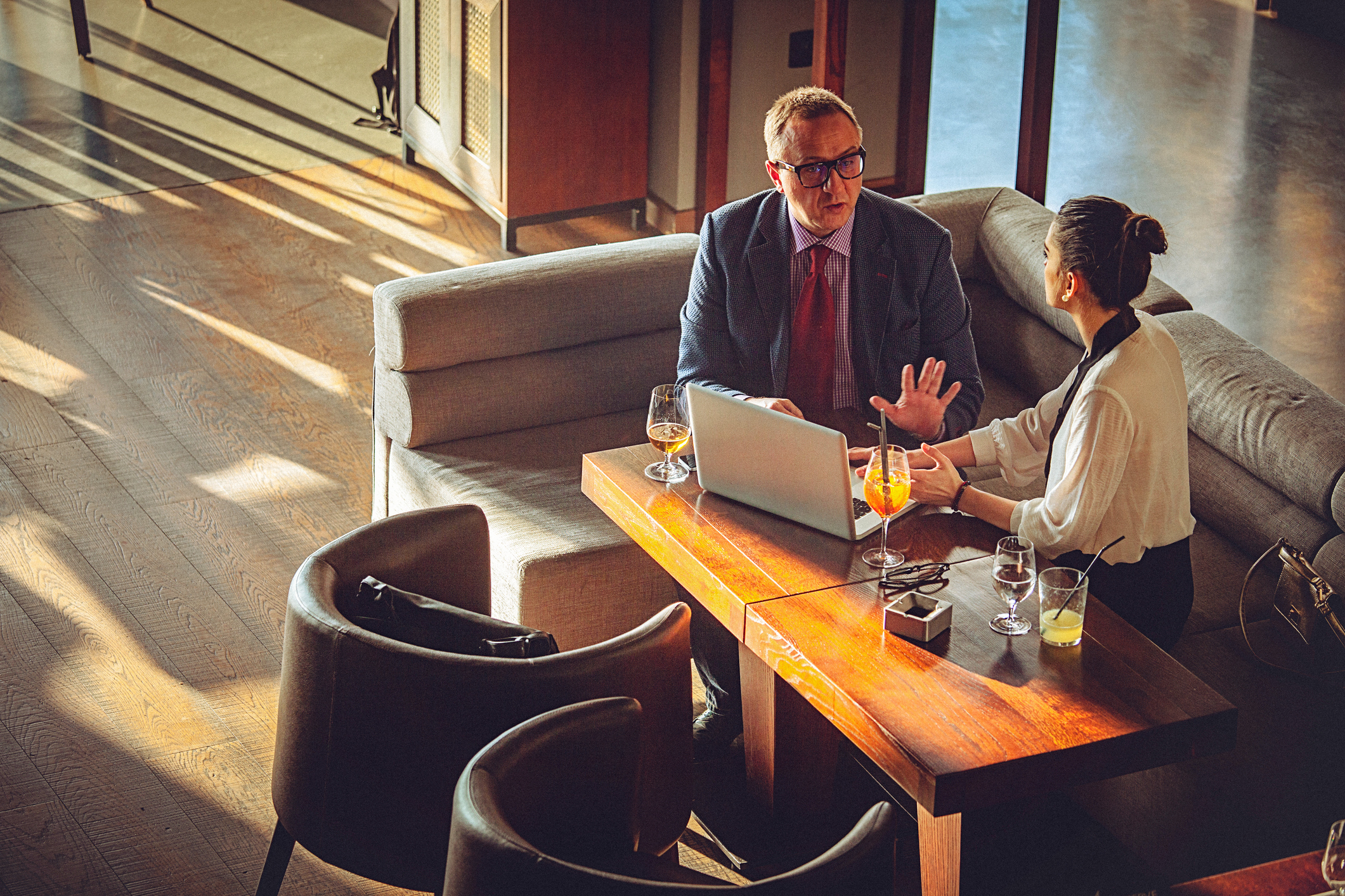 Two business consultants discussing in a office