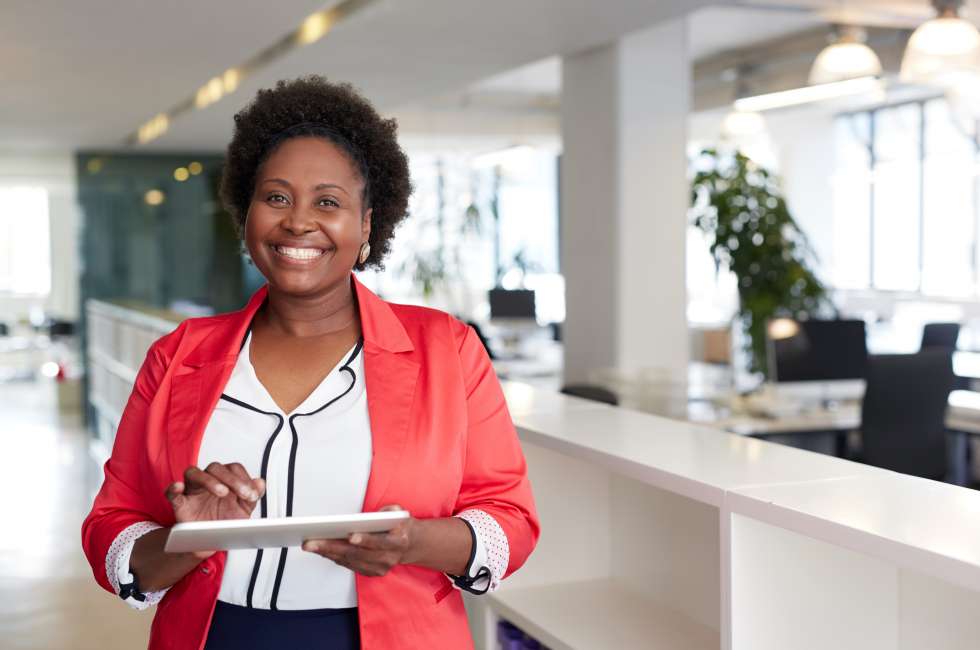 A happy Real Estate professional in the office