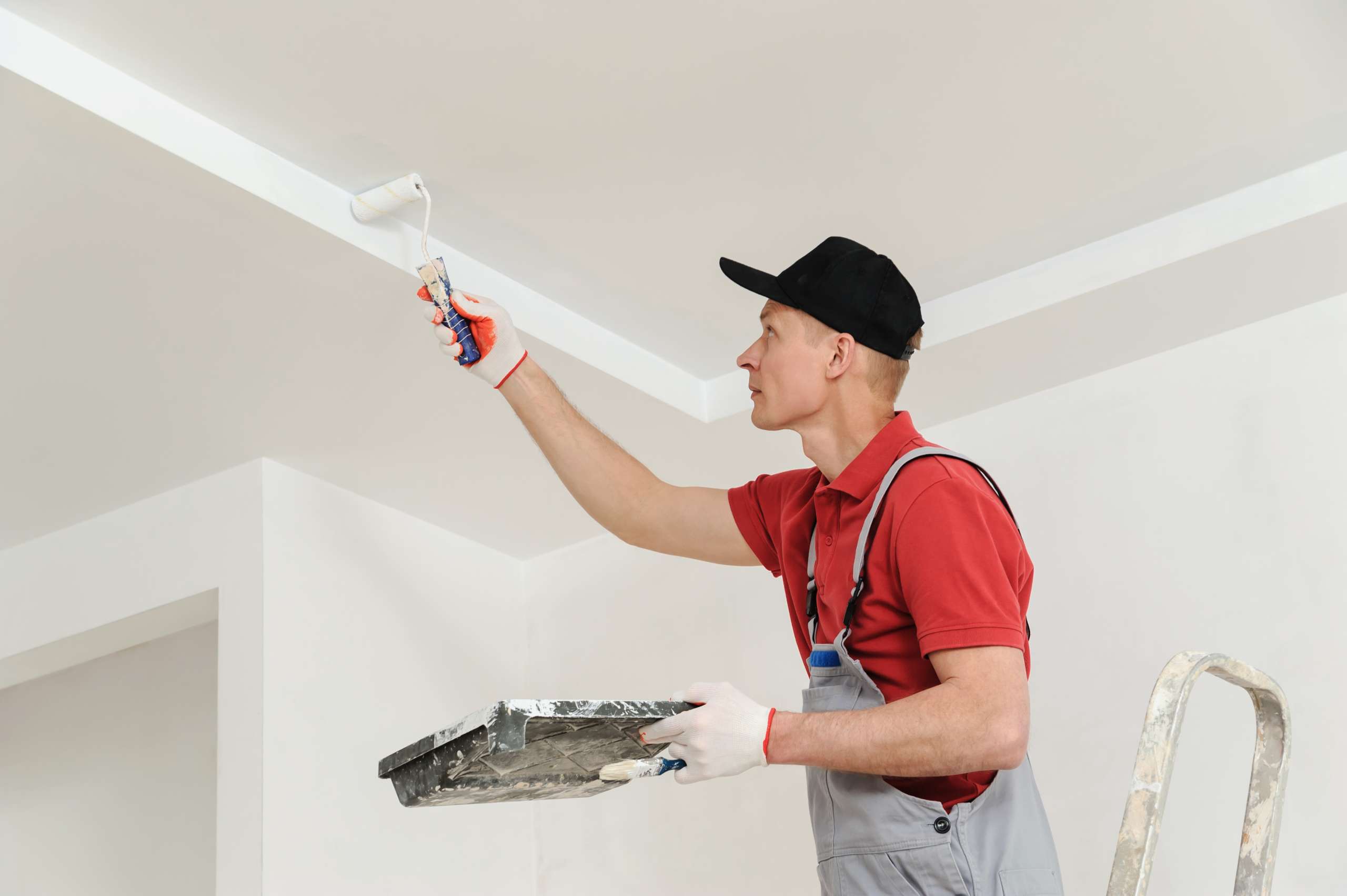 Painting Skills: a painter paints the ceiling walls.