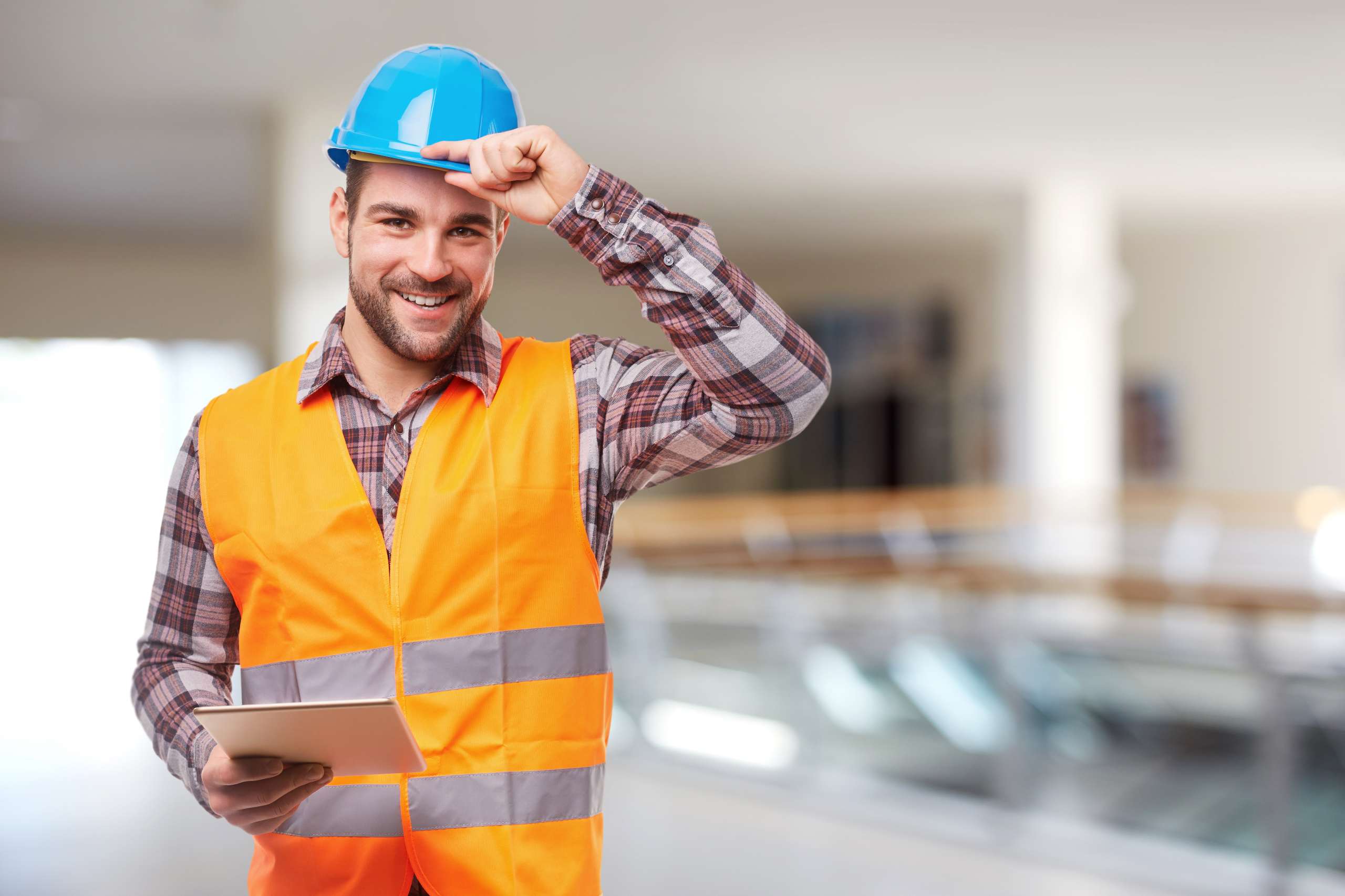 A Smiling contractor with digital tableta