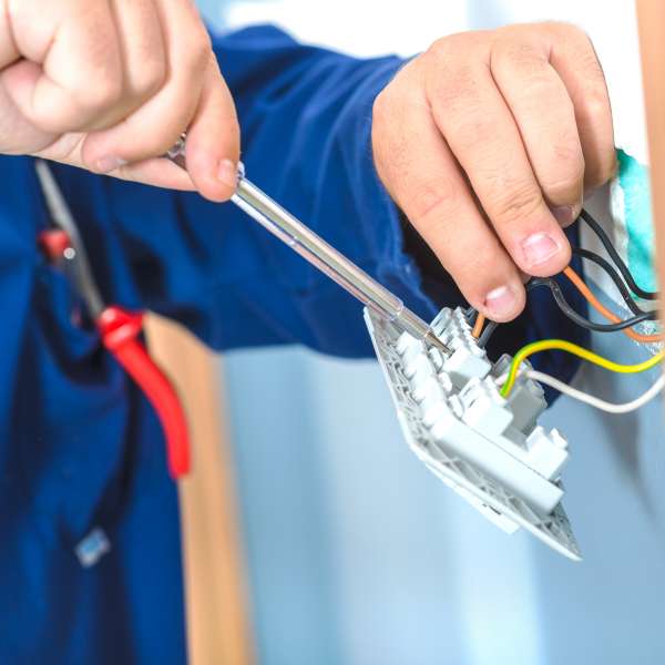 Electrician changing plugs