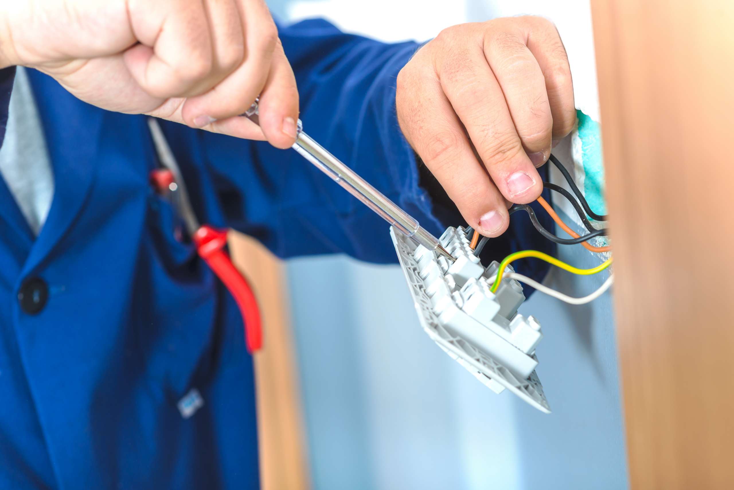 Electrician changing plugs