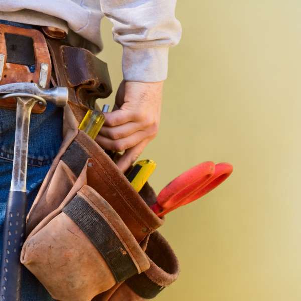 Handyman with tools in tool-belt.