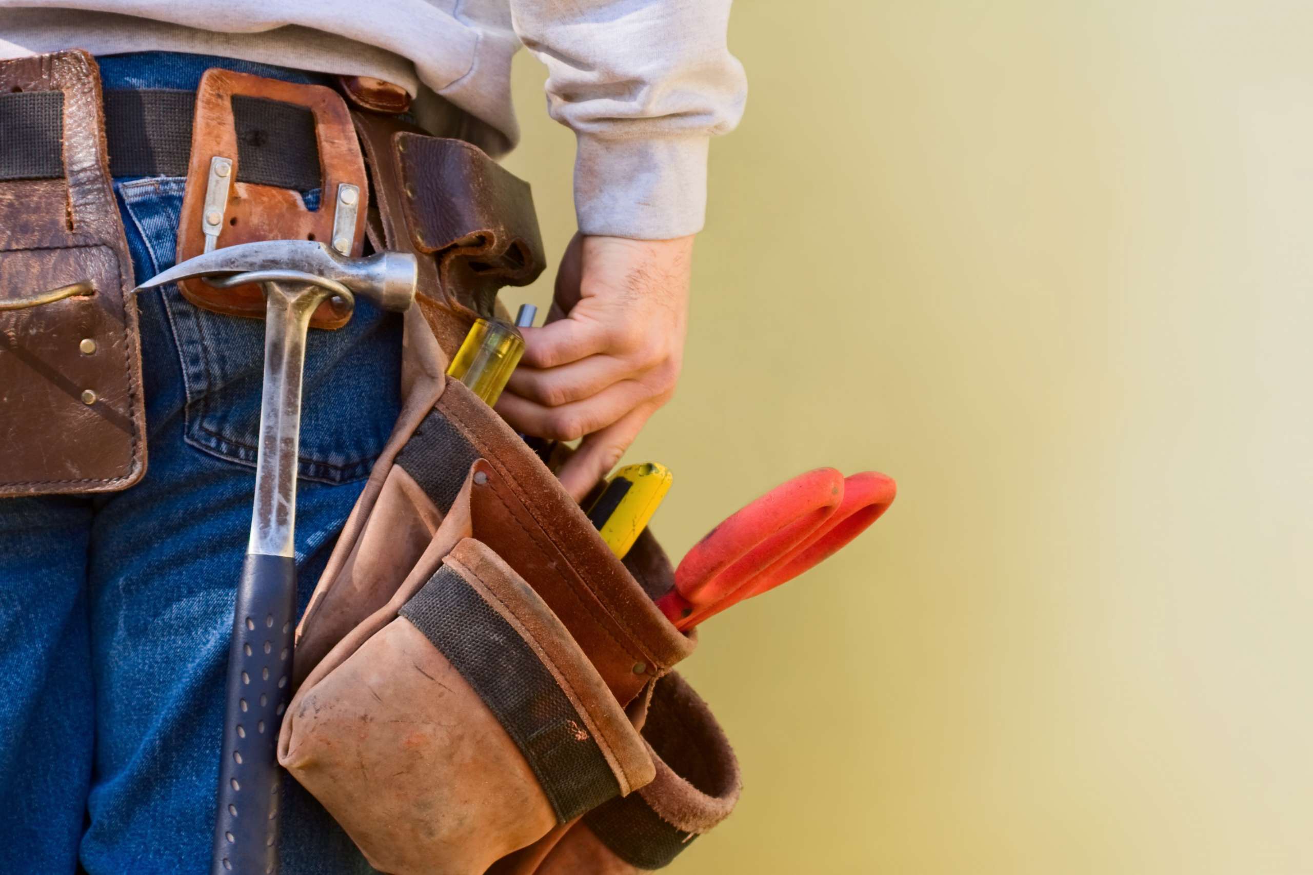Handyman with tools in tool-belt.