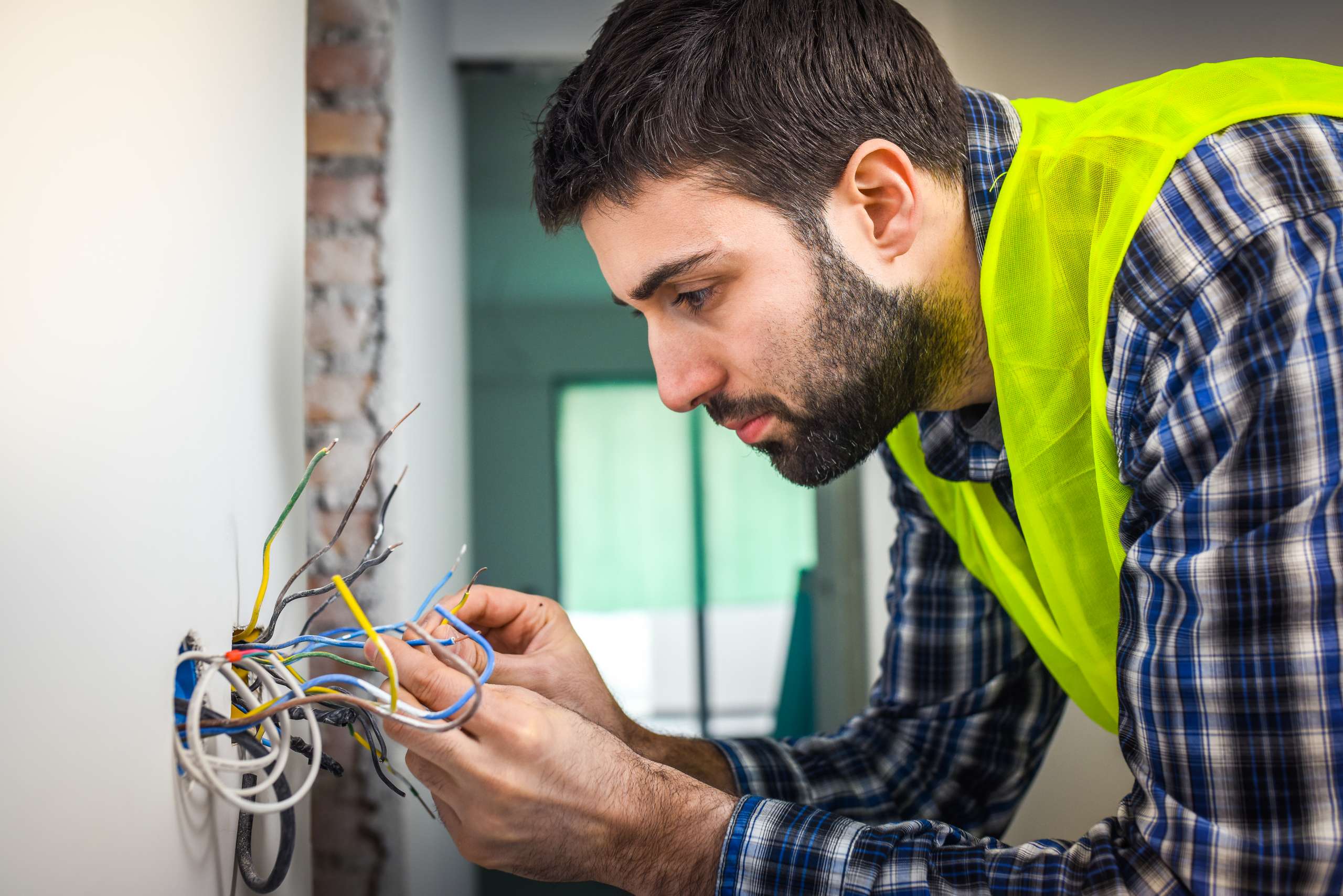 An electrician connecting wires