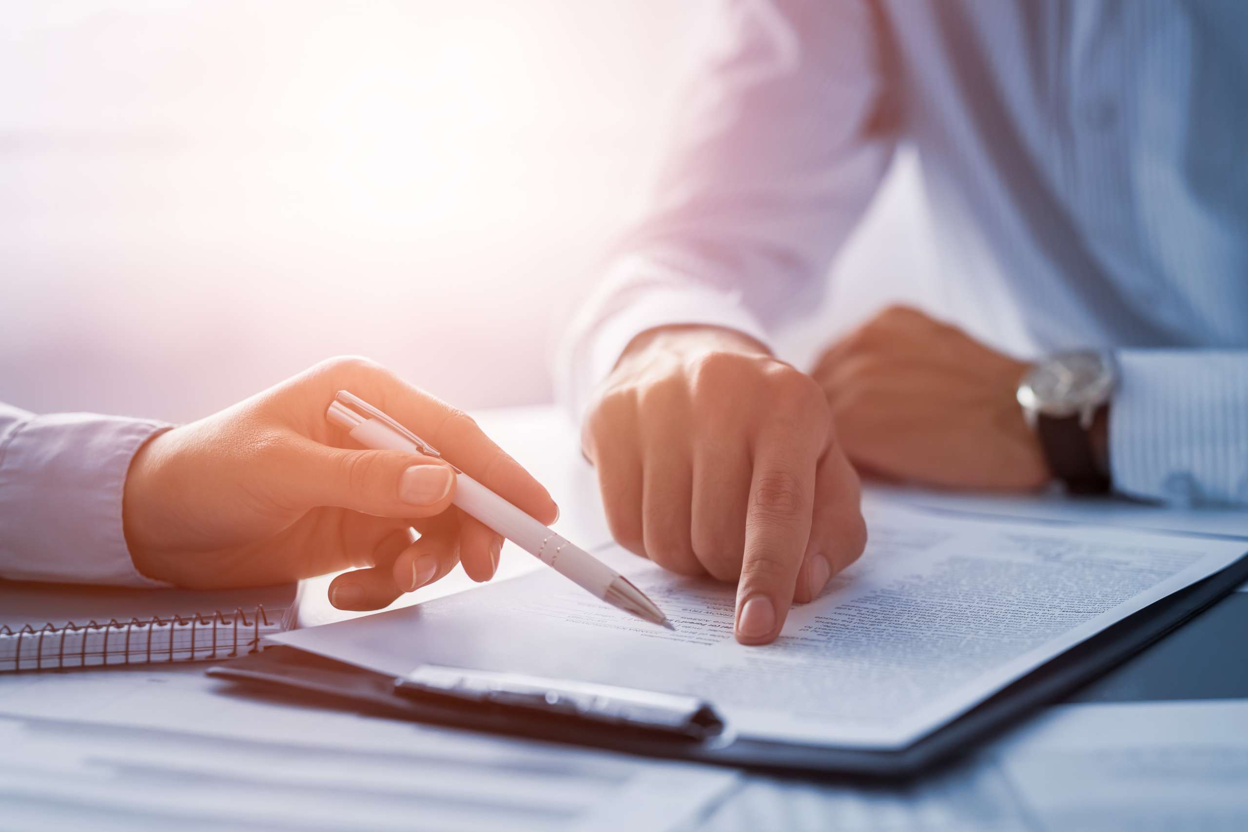 Business persons looking at a business document