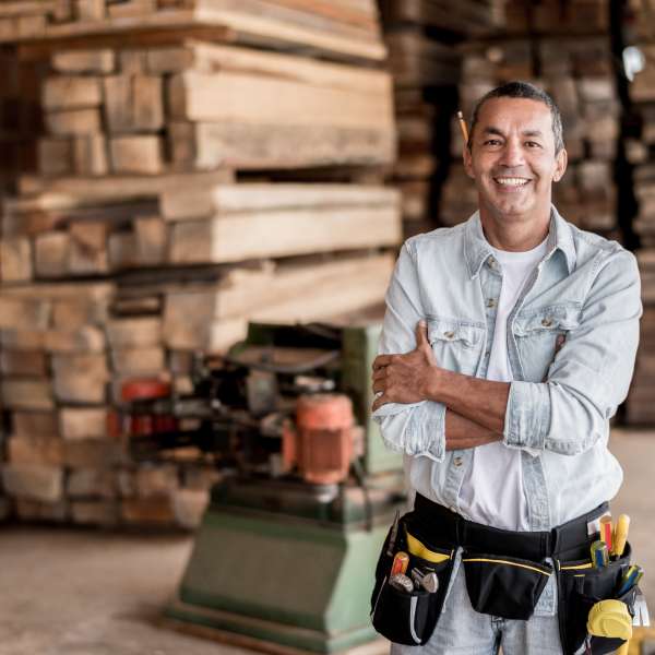 A happy carpenter at his workshop