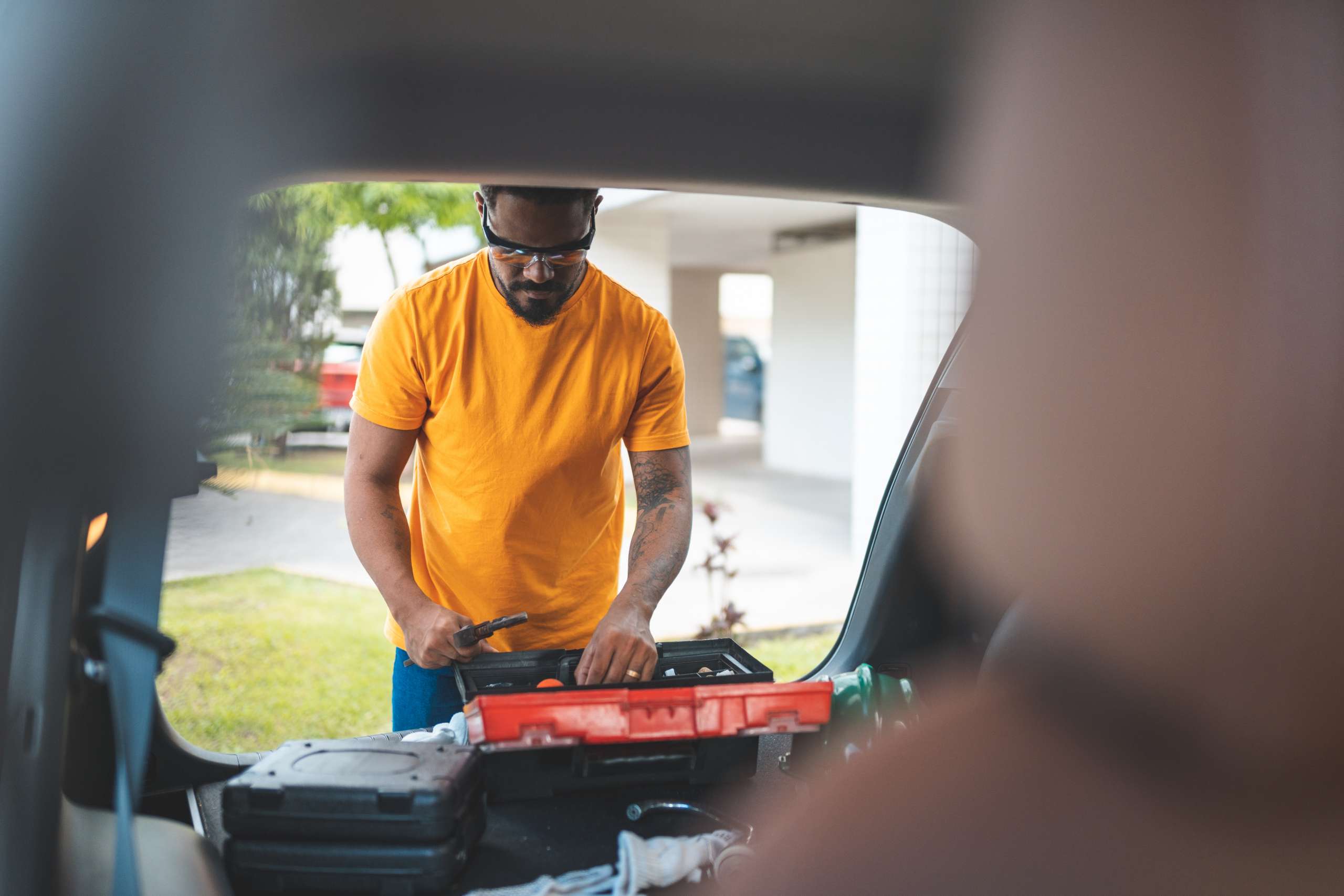 A electrician repairs a car