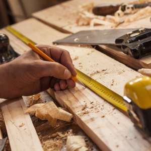 Carpenter taking measurement