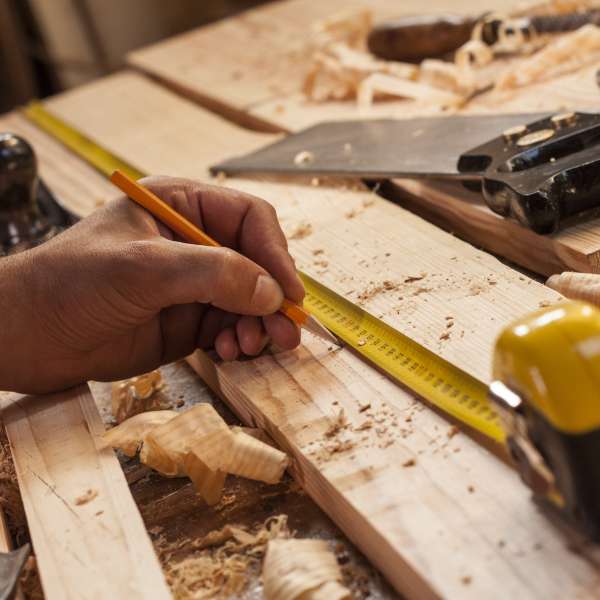 Carpenter taking measurement