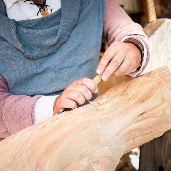 Carpenter working with wood iece
