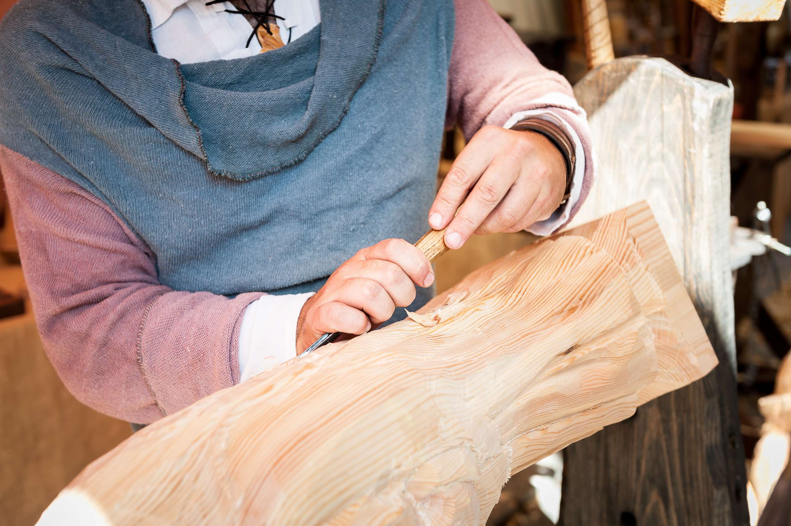 Carpenter working with wood iece