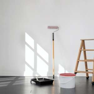 A painter painting the room