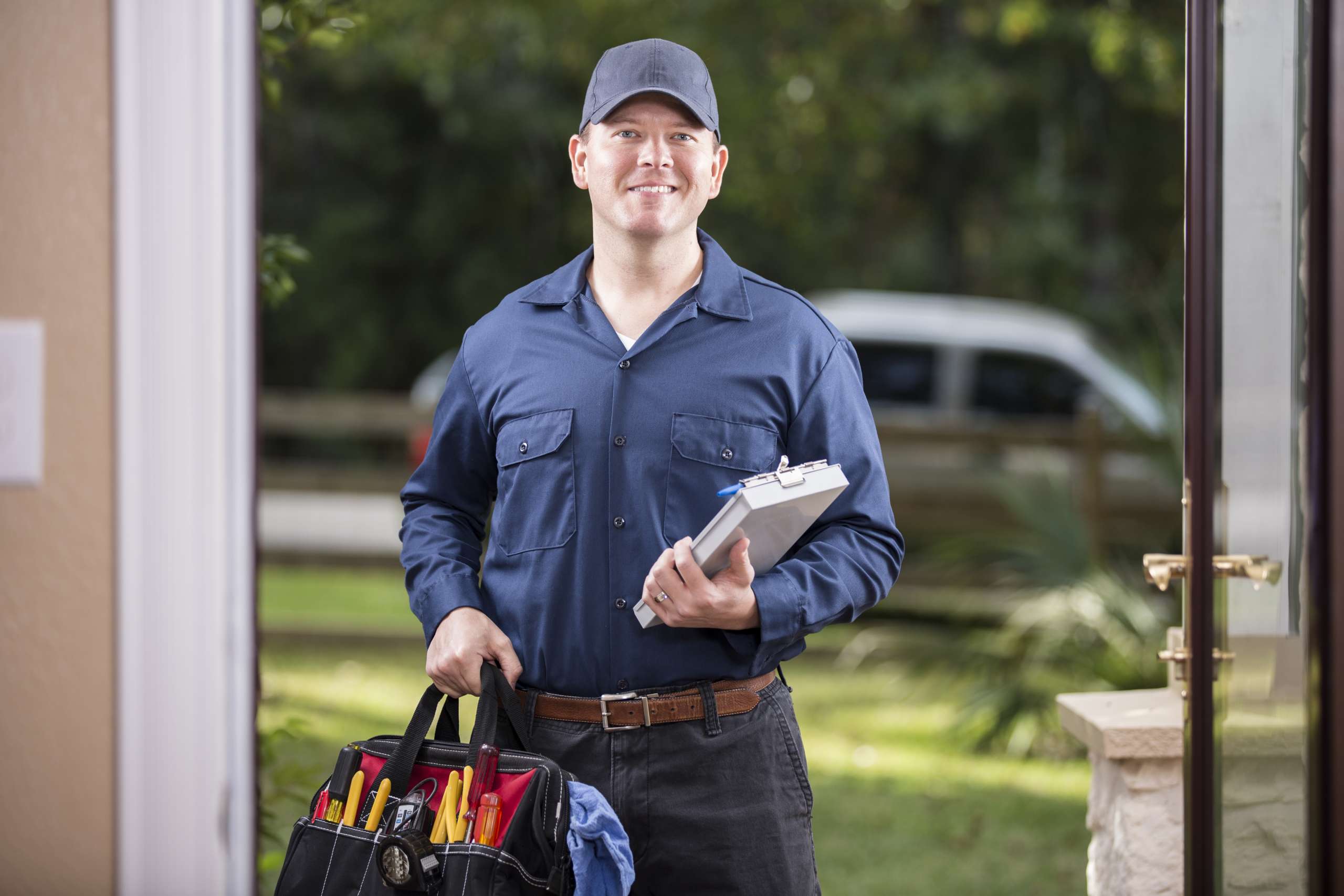 A handyman at customer door for a job