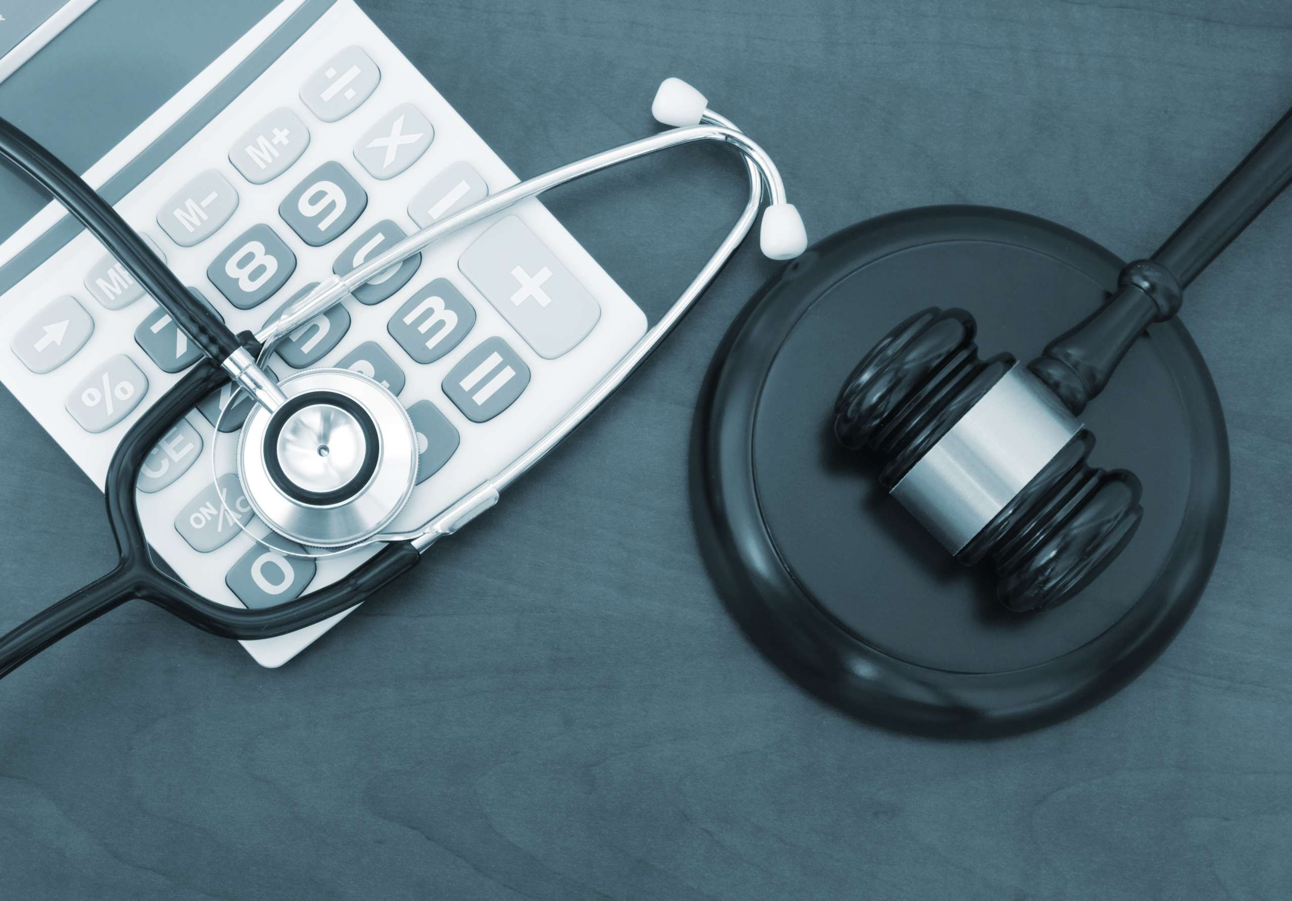 Home health equipment - Judge gavel, calculator and stethoscope