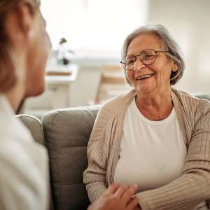 A senior persona and a health care worker