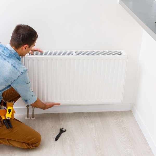 Man does maintenance repair works in the flat.