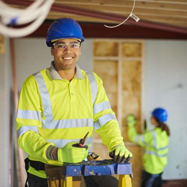 A happy electrician working on site