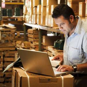 A business owner working in warehouse