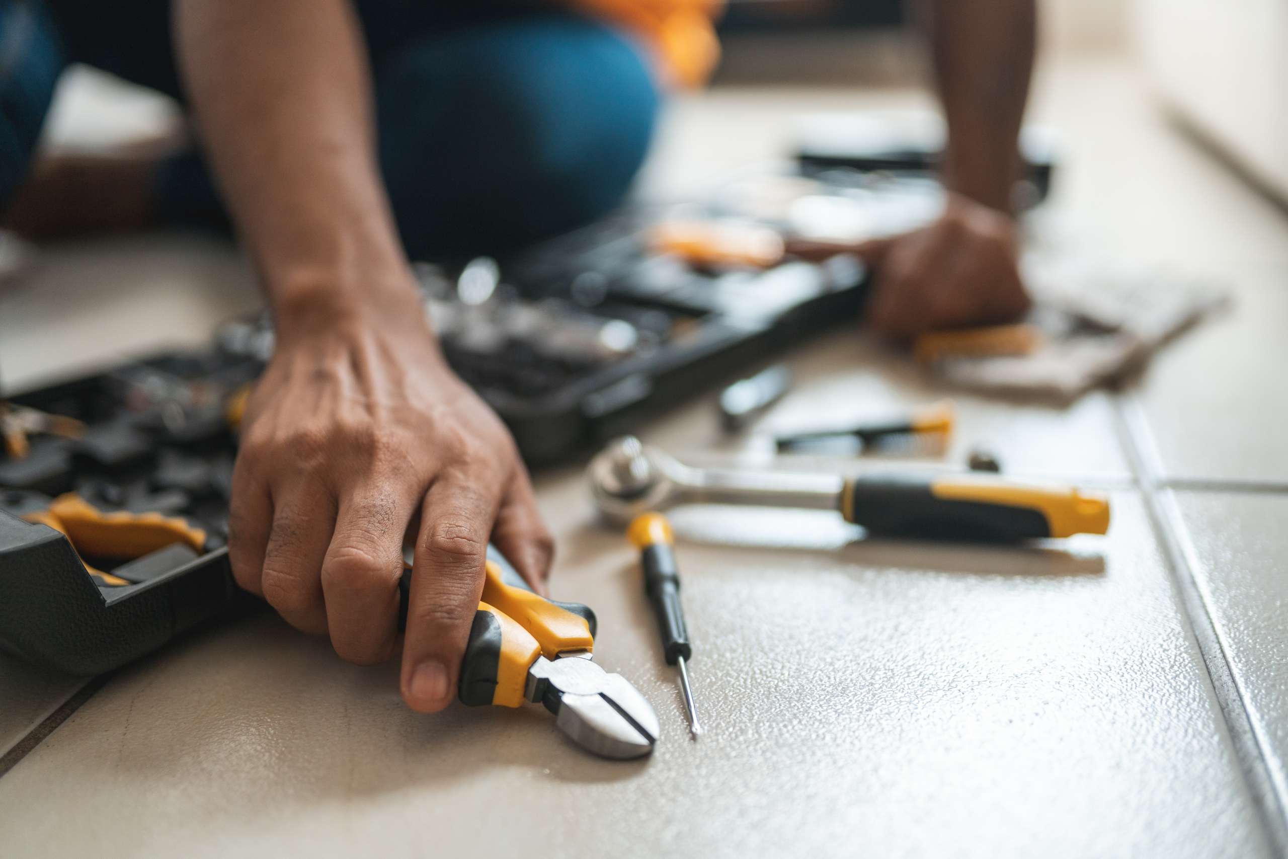 An electrician with working toolbox