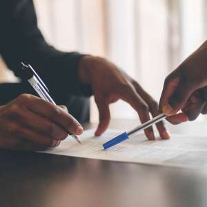 Business owner with pen and document