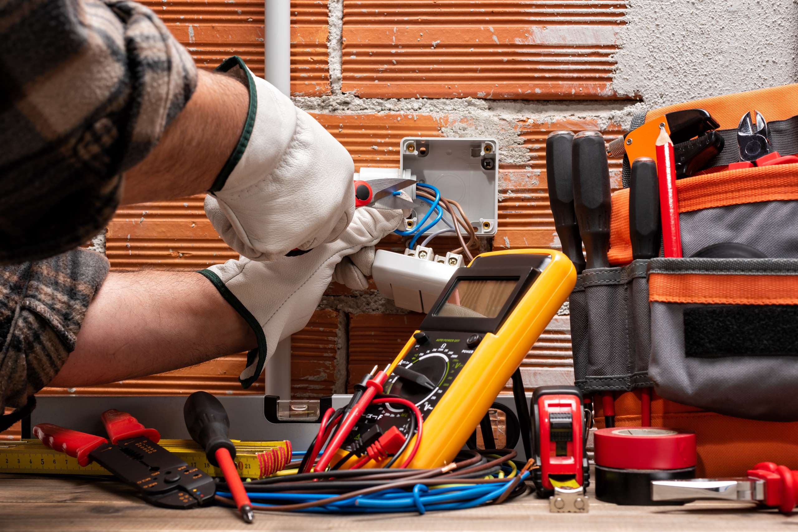 Electrician at work on a residential electrical system.