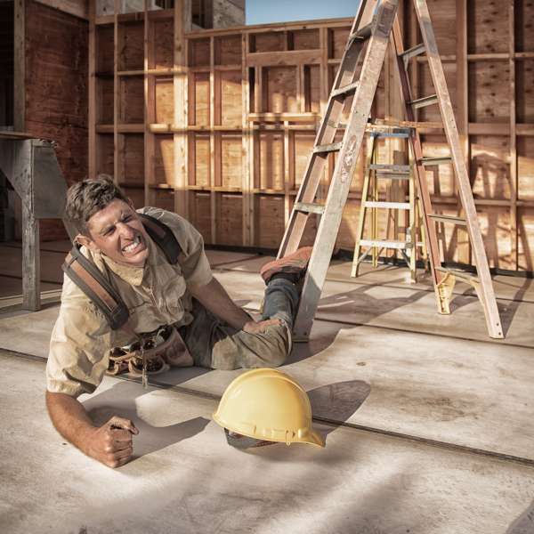 Carpenter building a home at construction site.