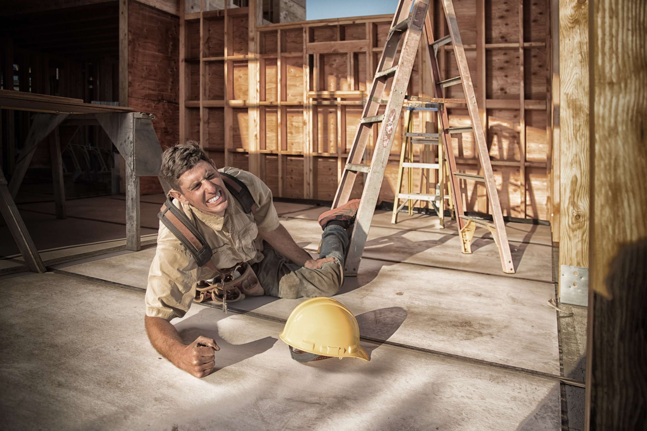 Carpenter building a home at construction site.