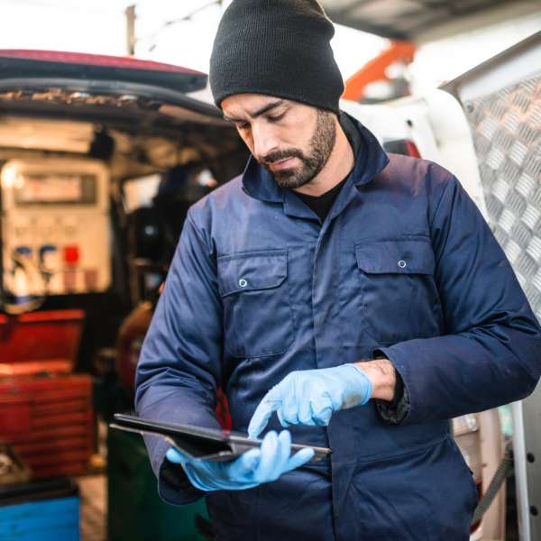 An electrician working at garage