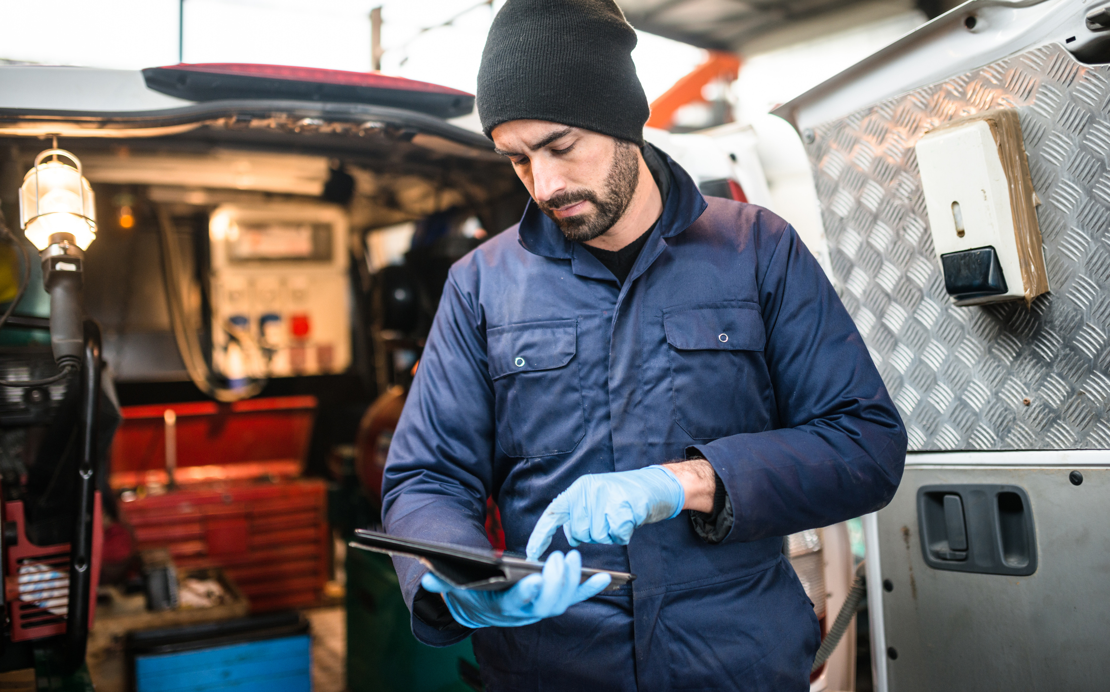 An electrician working at garage