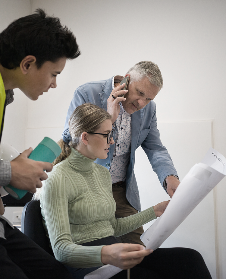 Architects looking at a paper