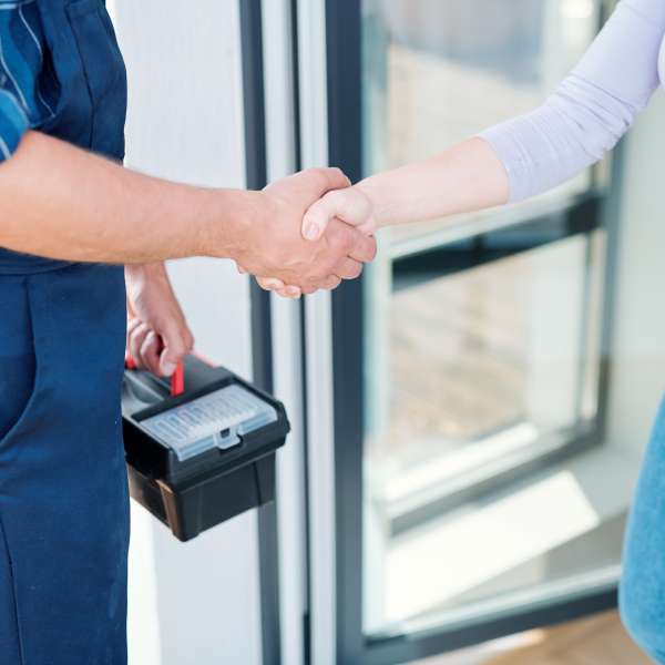 Home owner and technician shaking hands