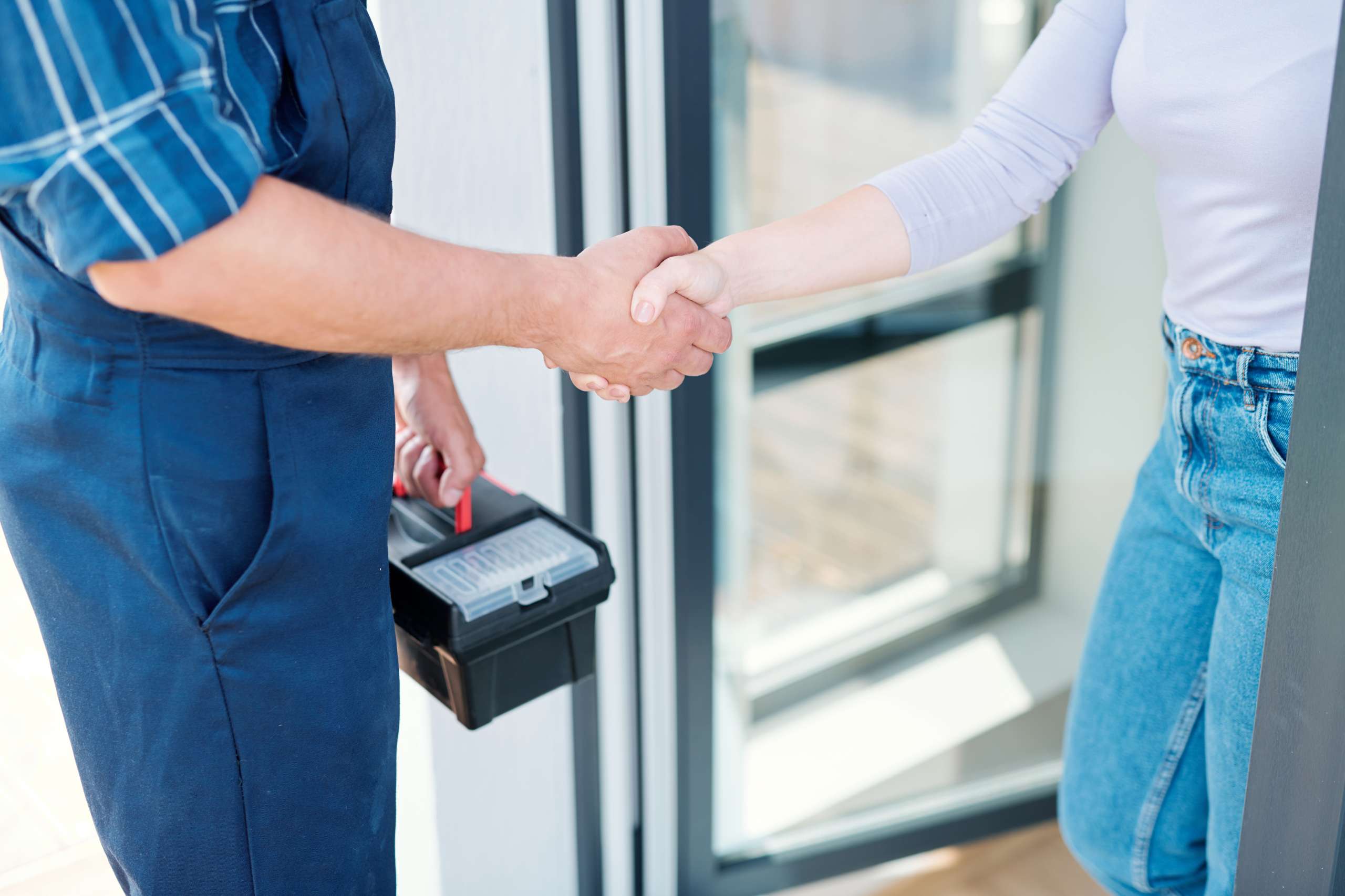 Home owner and technician shaking hands