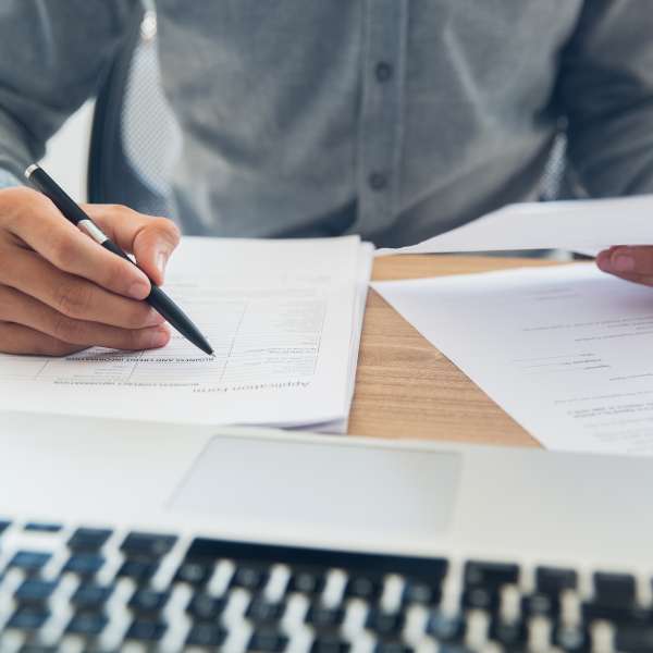 Businessman checking documents at table