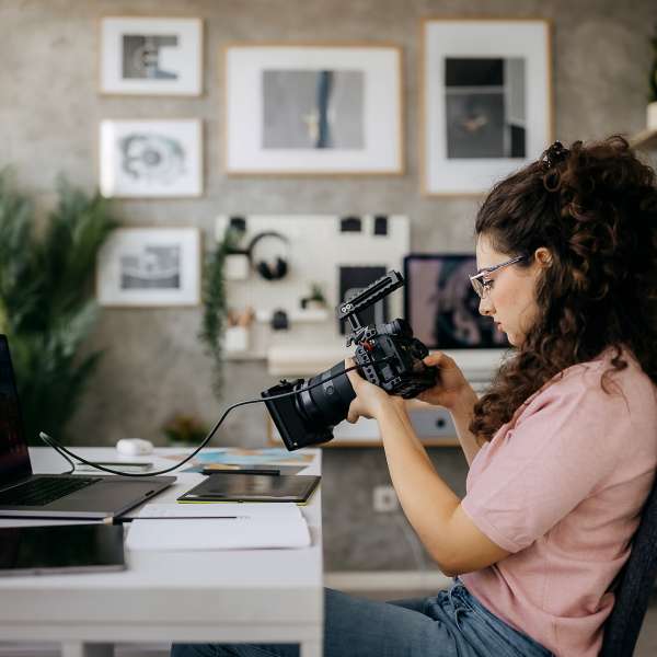 A photographer working from her home office studio