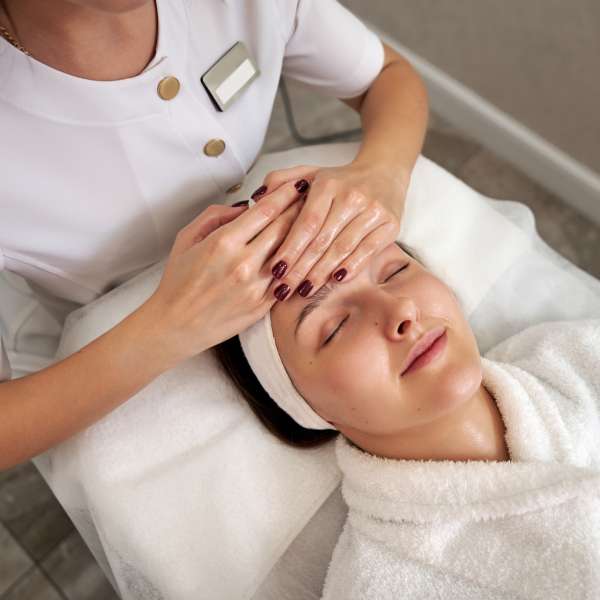 A young woman with skin specialist.