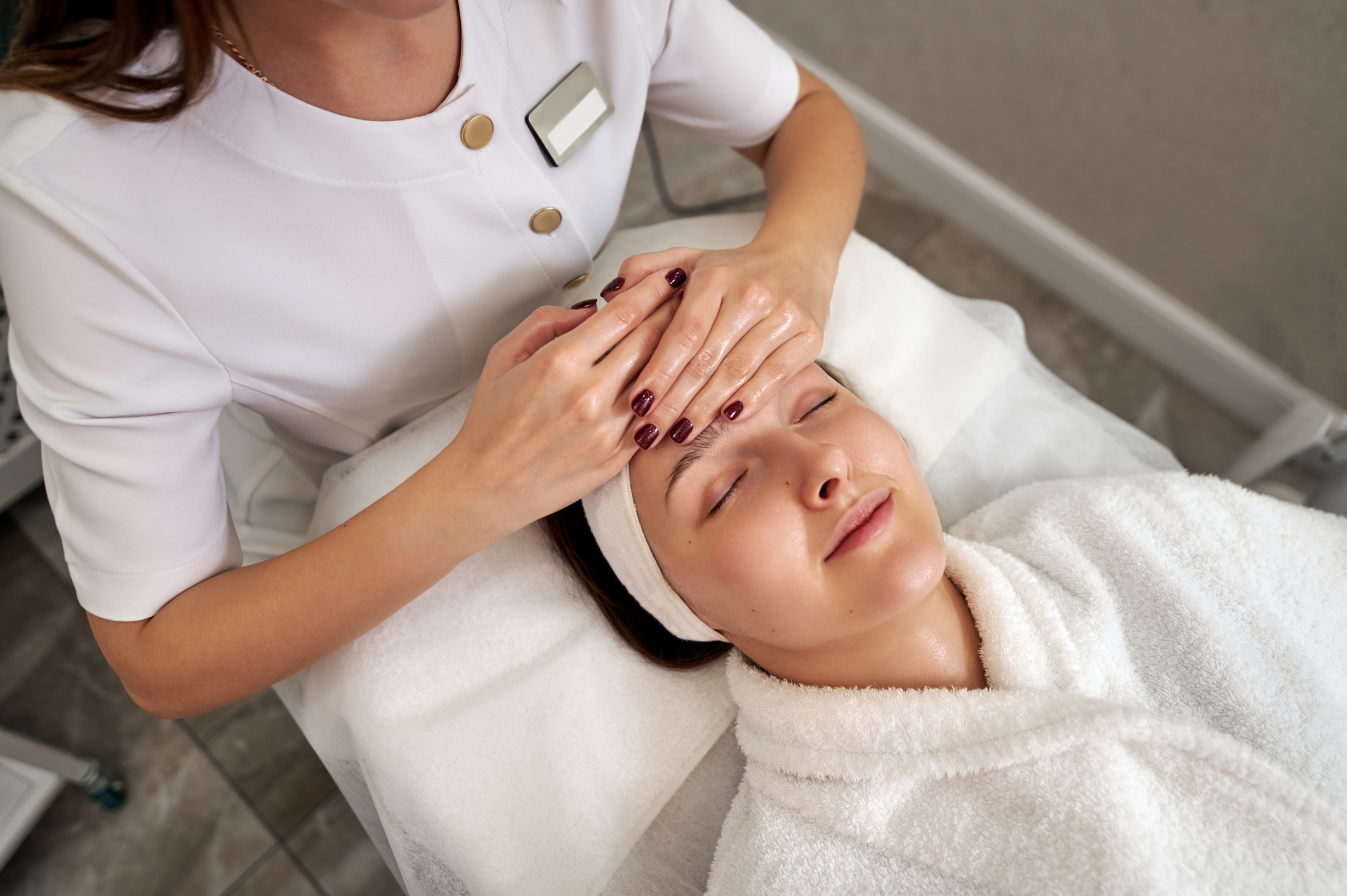 A young woman with skin specialist.