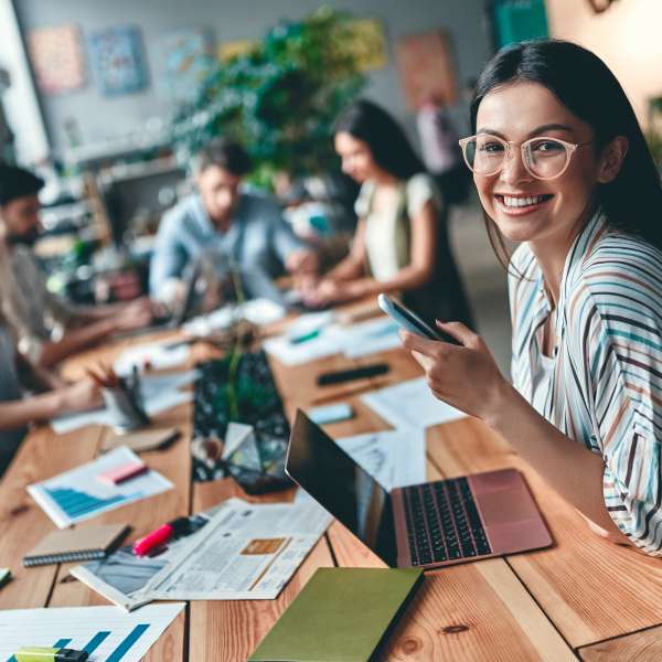 Group of young business people working together in modern office.