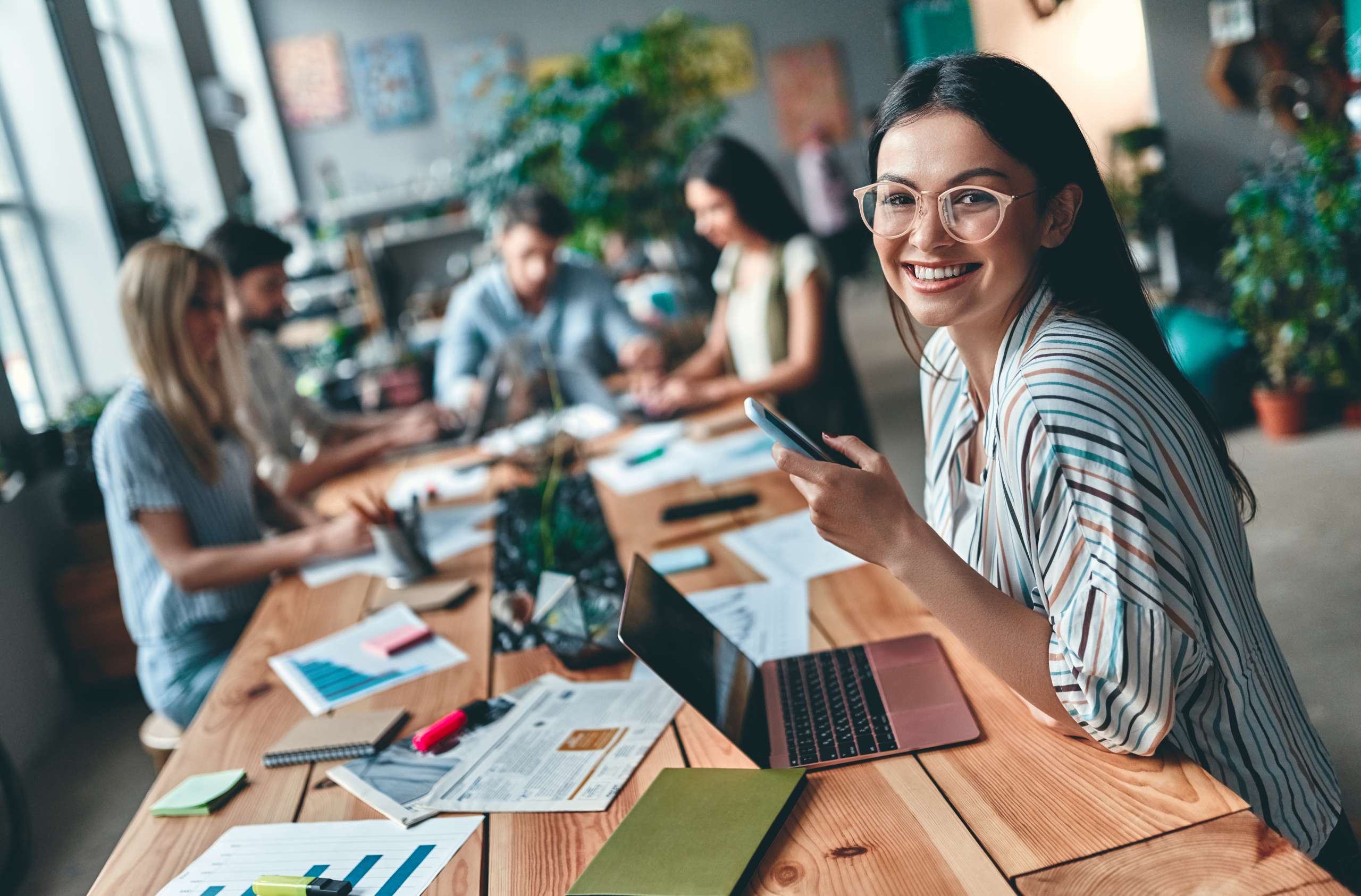 Group of young business people working together in modern office.