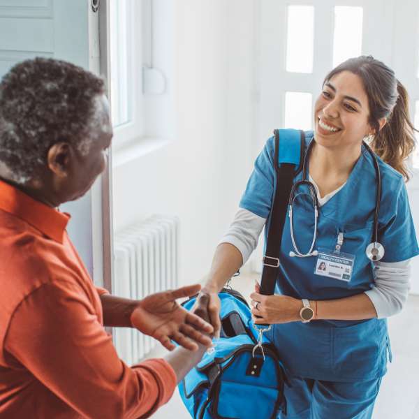 Nurse visiting patient at home.