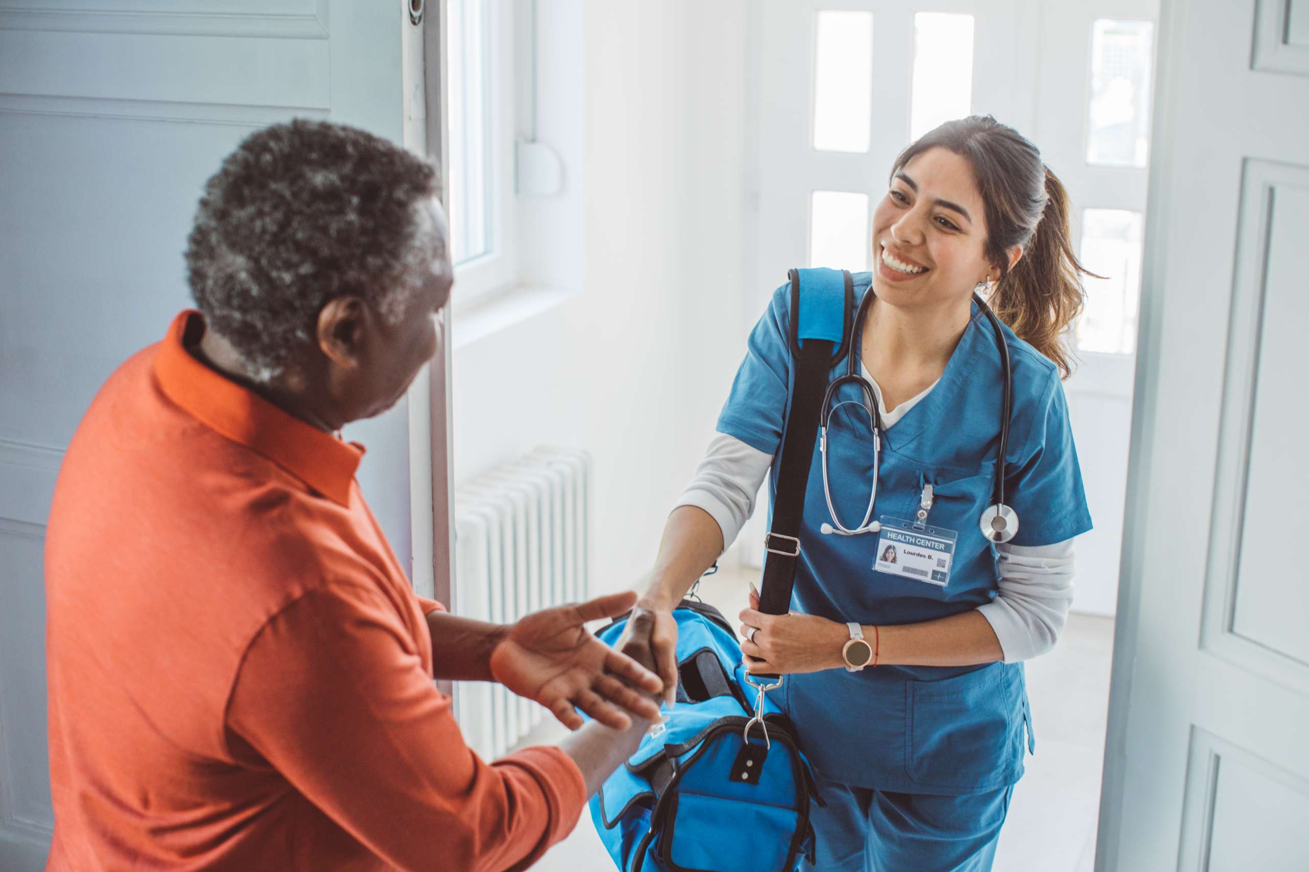 Nurse visiting patient at home.