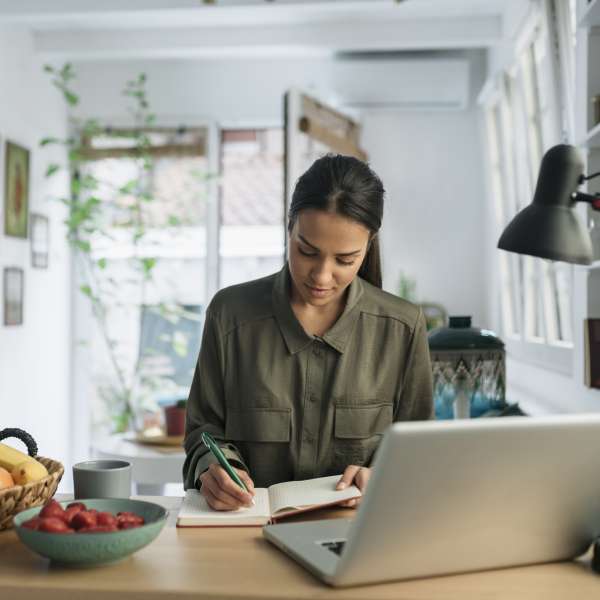 Young woman working in front of laptop