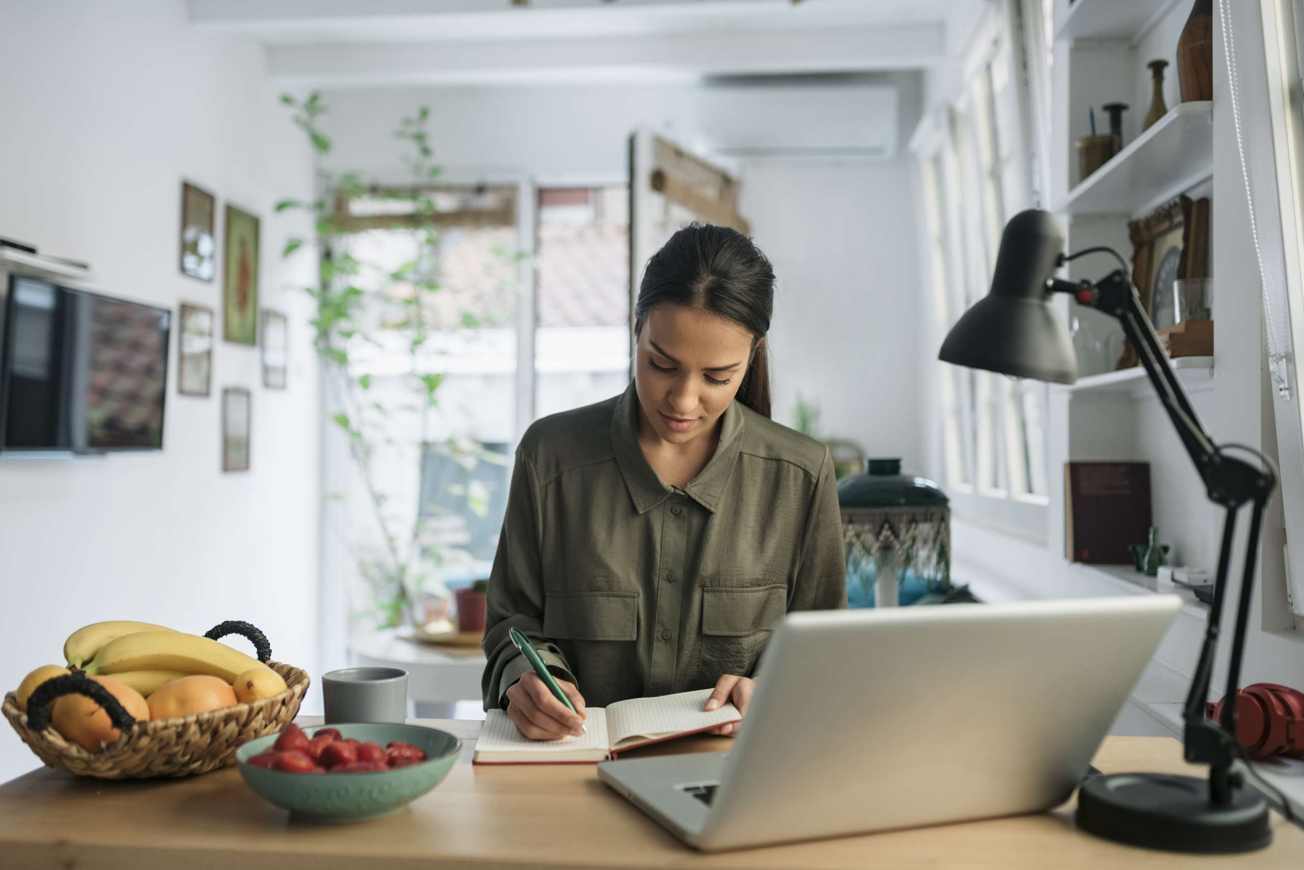 Young woman working in front of laptop