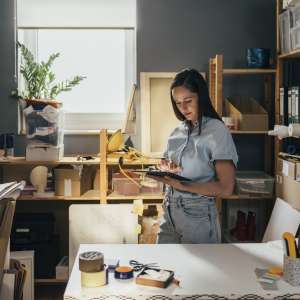 A female entrepreneur sitting in her home office