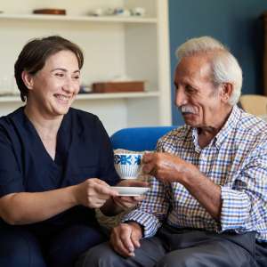 Professional helpful caregiver at nursing home.